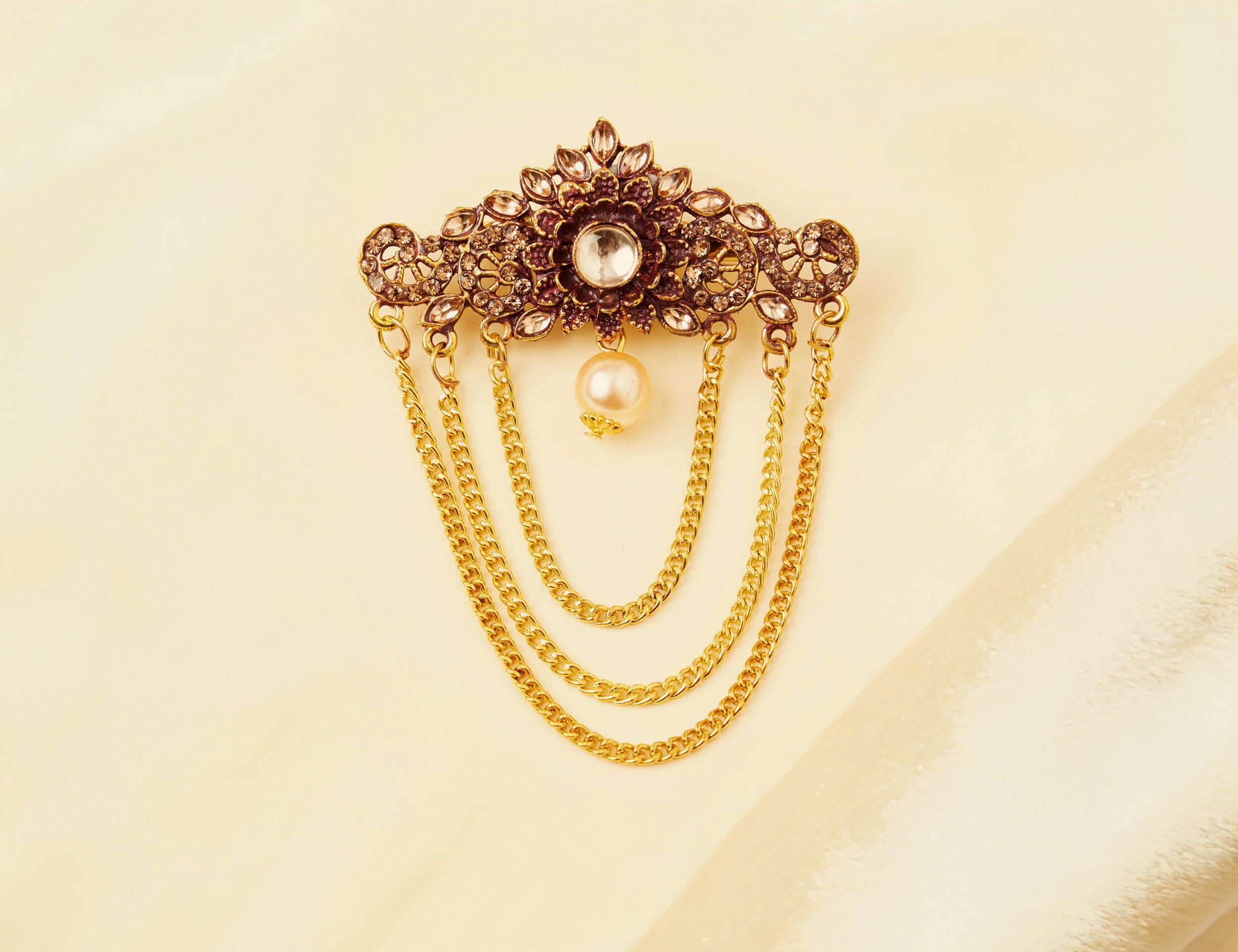 A Red and Gold Floral Brooch